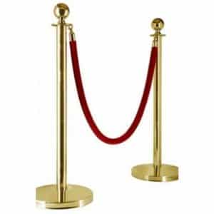 gold barrier post red rope